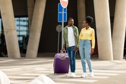 Travel. African American Spouses Standing With Suitcase Traveling On Vacation Posing Near Airport Terminal Outside. Full Length Shot Of Travelers Couple. Tourism And Transportation Concept
