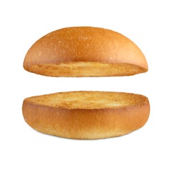 Burger bun empty isolated. American food classic burger round bread isolated at white background. Roasted toasted burger top without fillings flying, levitating at white. 