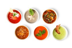 Variety of restaurant hot dishes, healthy food. Japanese miso, asian fish soup, russian borscht, english pea soup, mushroom soup, spanish gazpacho isolated at white. Top view, flat lay.