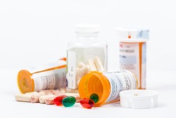 Isolated Orange Prescription Medication Bottles with Pills
