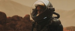 Caucasian female astronaunt wearing a space suit exploring red planet surface, Mars colonization concept