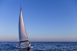 Sailing in the dusk in the Aegean sea, Greece