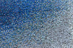 Detail of beautiful old collapsing abstract ceramic mosaic adorned building. Venetian mosaic as decorative background. Selective focus. Abstract  Pattern. Abstract  colored  ceramic stones