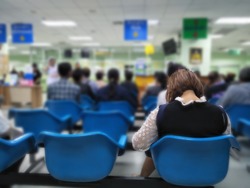 young woman and many people waiting medical and health services to the hospital,patients waiting treatment at the hospital,blurred image of people