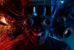Photo of a cyberpunk male head portrait with robotic helmet with wires, metal parts and binoculars on black background.