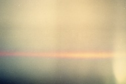 Abstract film texture background with heavy grain, dust and light leak