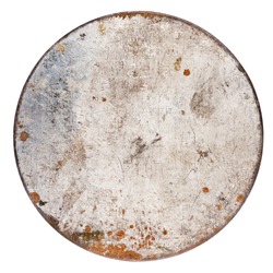 Rusty round metal plate isolated on white