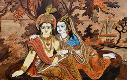 Raised crafted Indian Hindu Gods Krishna and Radha on wood, whole background