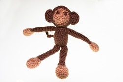 Crochet little toy cuddly monkey filled with absorbent cotton