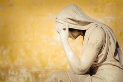 Vintage statue of a crying woman with space for text