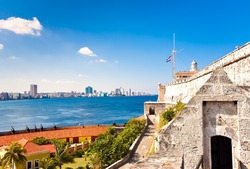 The castle and lighthouse of El Morro in Havana with a view of the city in the background