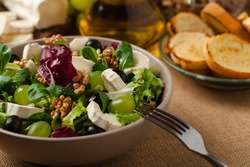 Italian spring salad with goat cheese, grapes and walnuts. Served with croutons.