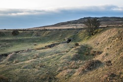 Beautiful rugged countryside on Dartmoor near Cox Tor with evening light