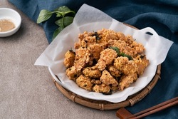 Close up of delicious fried popcorn chicken food in Taiwan for famous night market street food delicacy.