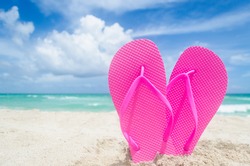 Valentine's day background with heart on the sandy Miami beach near ocean in sun day