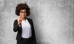 business black woman doing number one gesture