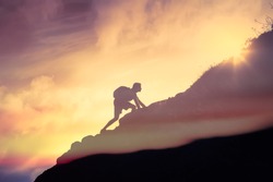Man climbing up a mountain. Motivation, and inspiration concept. 