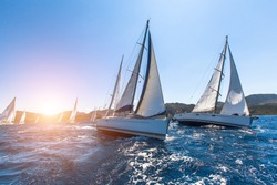 Luxury yachts at Sailing regatta. Sailing in the wind through the waves at the Sea. 