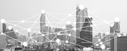 business connection in the city with digital graphic link network internet of things and information communication technology buildings black and white background