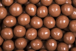 A background of milk chocolate sweets.