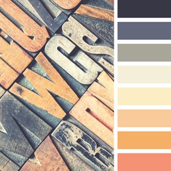 A background of vintage letterpress blocks in a colour palette with complimentary colour swatches.