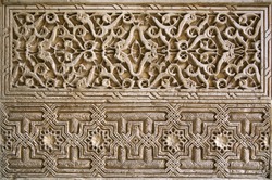 Detailed panel of the intricate patterns on a wall of the Alhambra Palace, Granada, Spain