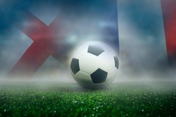 England vs France football match , Quarter-finals , national flags and soccer ball on green grass