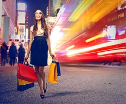 beautiful woman with many shopping bags