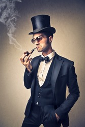stylish man smoking a pipe