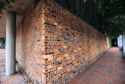 Perspective, side view of old red brick wall texture background.