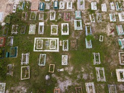 Aerial view of a Muslim cemetery compound in Malaysia. Generally the graves do not arranged systematically but the janazah's head will always face the kiblah. Selective focus points