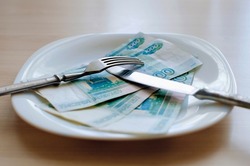Russian rubles on a white plate, Close-up, selective focus. Keep money on the fork. Minimum subsistence level, food basket, minimum wage. Concept. Eat money, living wage. Economy. Crisis, inflation