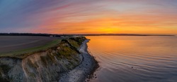 Panorama aerial view of sunset on the steep coast of the Baltic Sea.Panorama of wild romantic coastal cliff landscape at the Baltic Sea at the Wangels, by Hohwacht Bay, Ostholstein, Schleswig-Holstein