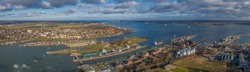 Panorama aerial view of the Kiel Canal waterway with lockage Holtenau. Cargo ships pass the Holtenau lock of the Kiel Canal. Industrial area at the Kiel Canal.