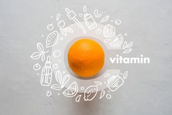 Orange and letter C on a yellow background. Concept of Vitamin C Doodle style icons image Flat lay Concept of protecting immunity during viral infection