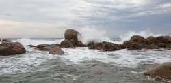 Waves crashing against rocky shoreline