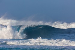 huge perfect wave breaking at pipeline beach in hawaii