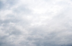 Gray blue sky background with tiny clouds