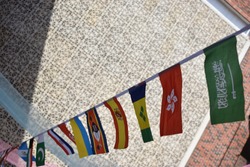 Flags of many countries, put together on a string in an international conference