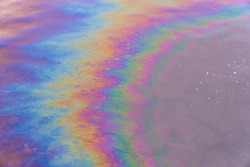 Oil petrol water pollution. Ecological disaster. Slick industry oil fuel spilling water pollution. Water with patches of gasoline and oil. Ecological catastrophe.  Concept of environmental problems
