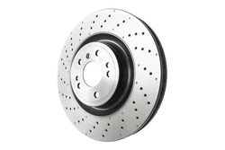 Car brake disc isolated on white background. Auto spare parts. Perforated brake disc rotor isolated on white. Braking ventilated discs. Quality spare parts for car service or maintenance