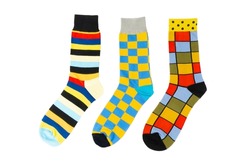 Three sock with different lines isolated on white background. Colorful sock son white background. Colored socks on the leg isolated on white background