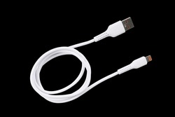USB cable isolated on black background. Mobile phone charging cable. White USB cable for charging a smartphone isolated