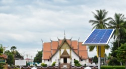 Photovoltaic panel installed infront of Wat Phumin Temple, Nan, Thailand. Concept for using grean and clean energy everywhere in the world to ruduce global warming and air pollution.