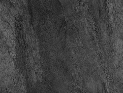 Natural black volcanic seamless stone texture venetian plaster background. Dark volcanic rock venetian plaster stone texture grain pattern. Black seamless grunge charcoal background texture rock