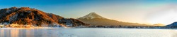 ฺMountain Fuji in panoramic atmosphere in the beautiful sunset with the cold air that freezes the lake