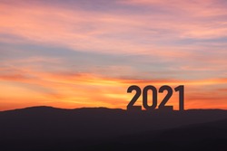 New year 2021 concept with sunset sky and mountain background, Silhouette style