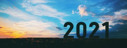 New year 2021 concept with sunset sky and mountain background, Silhouette style