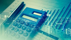 Double exposure of city and pen, calculator , graph for finance and business concept