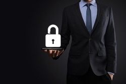 Businessman holds an open padlock icon on his palm.unlocking a virtual lock. Business concept and technology metaphor for cyber attack, computer crime, information security and data encryption